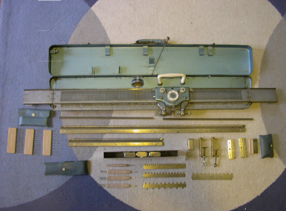 Brother KH 35 KewlCat Designs knitting machine and parts spread out on floor